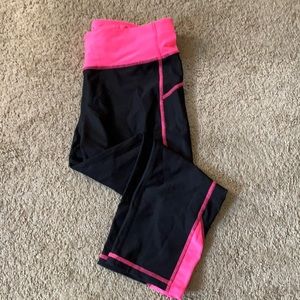 Black/pink compression capris.